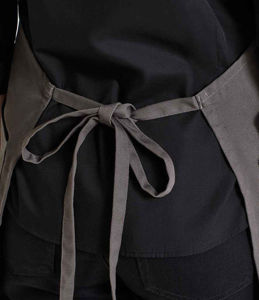 Premier Recycled Polyester and Fairtrade Organic Cotton Bib Apron - model image